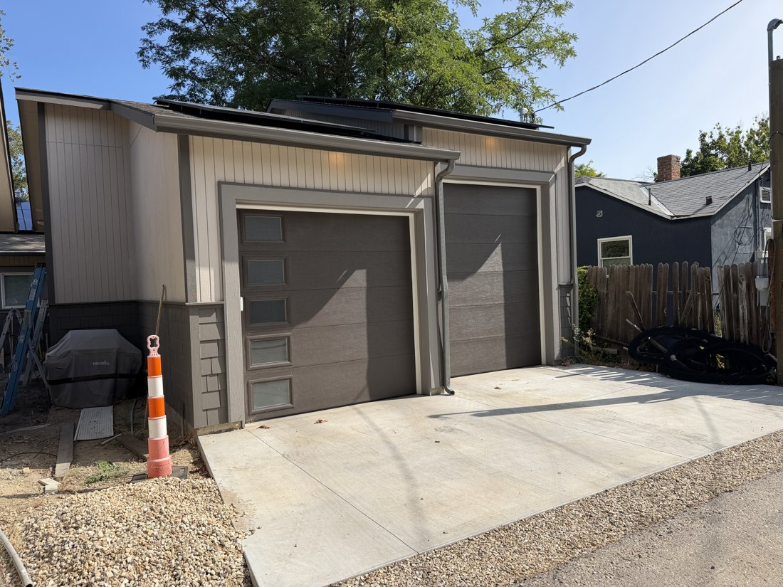 South side, viewed from the southwest. View of the rear yard and associated building fabric from the service area.
