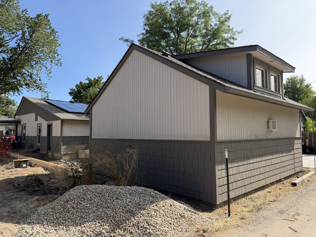 South side, viewed from the west. View of the rear yard and associated building fabric from the service area.