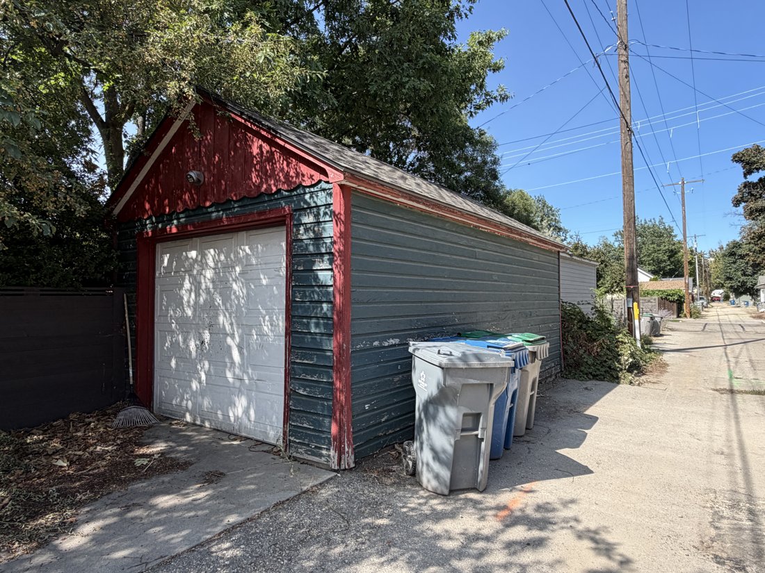 North side, viewed from the northeast. Detached accessory building and alley relationship.