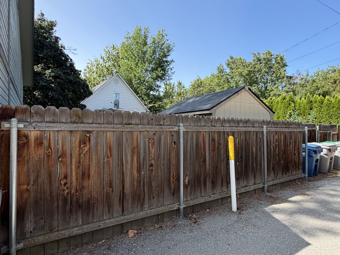 North side, viewed from the northeast. Detached accessory building and alley relationship.