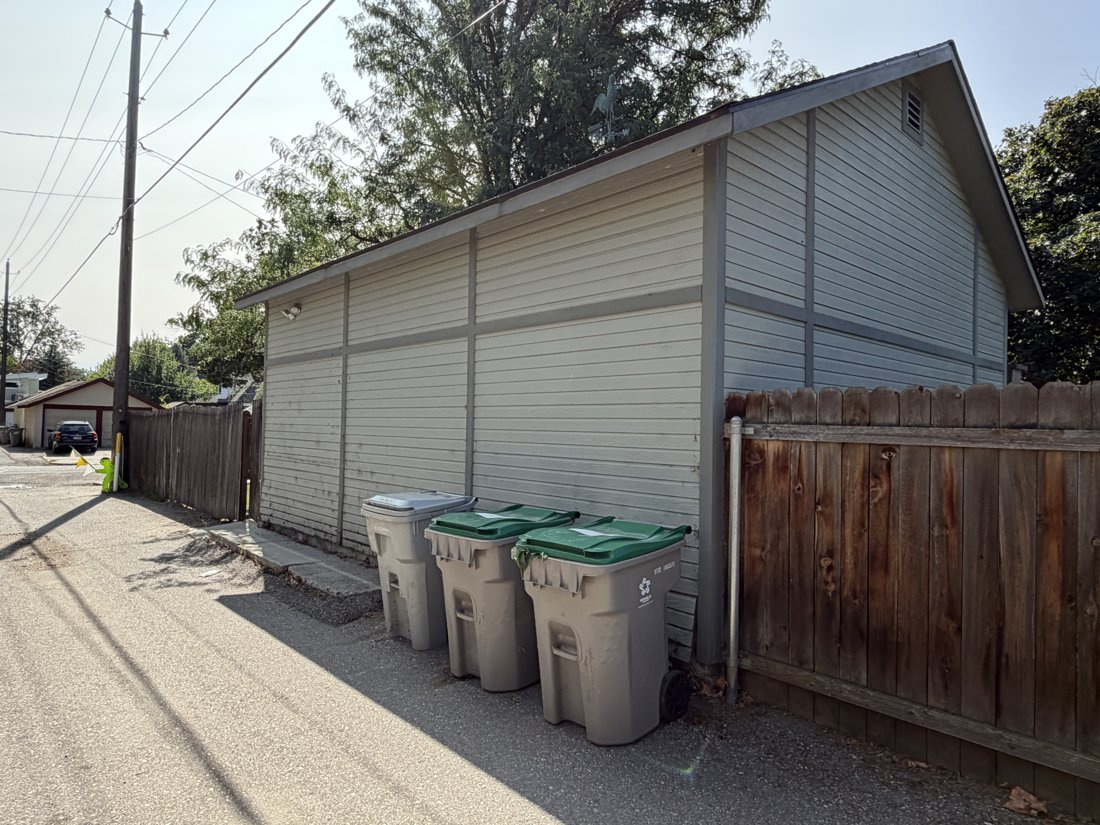North side, viewed from the northwest. Detached accessory building and alley relationship.