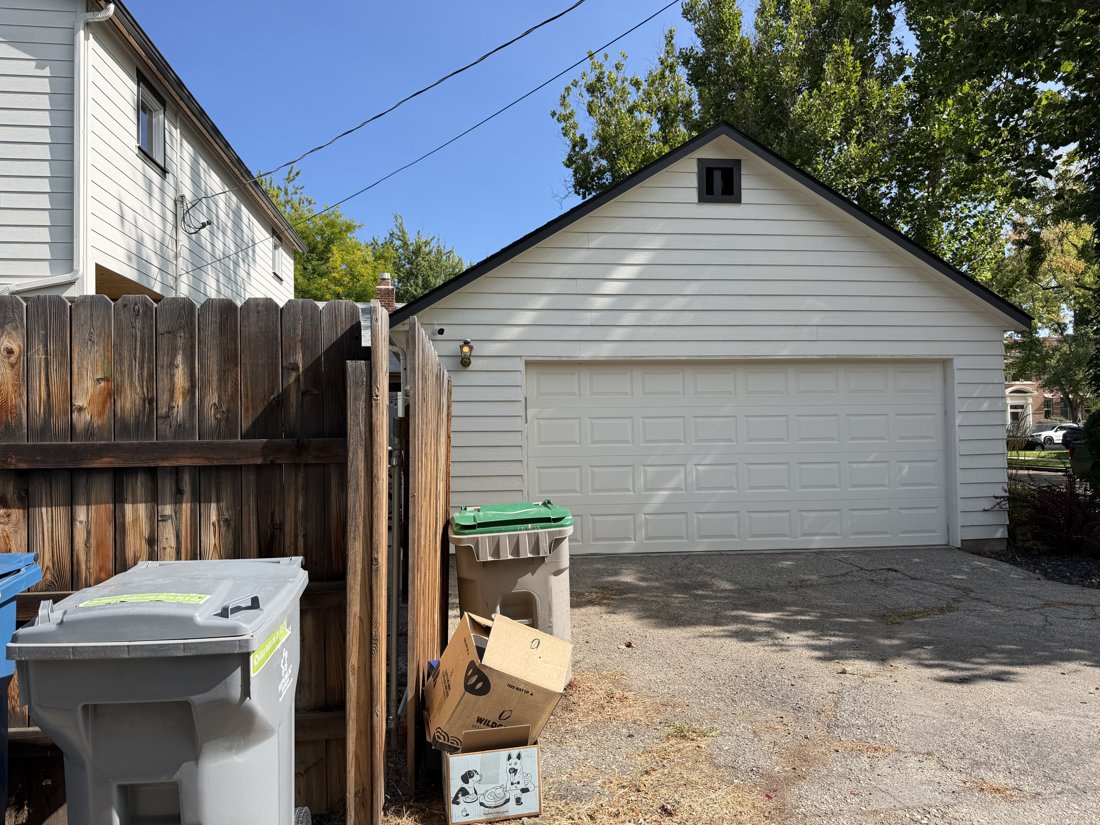 South side, viewed from the west. Detached accessory building and alley relationship.