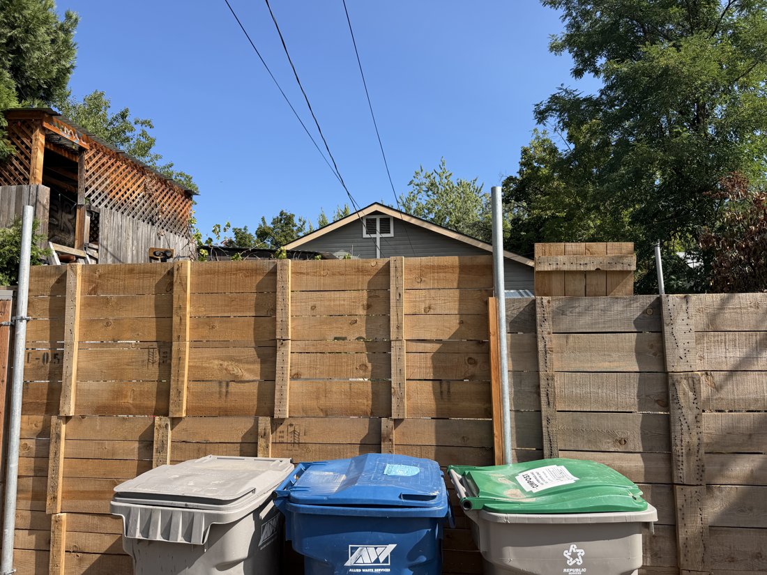 South side, viewed from the west. View of the rear yard and associated building fabric from the service area.